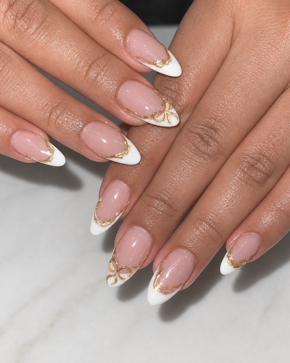 White French manicure with delicate gold accents